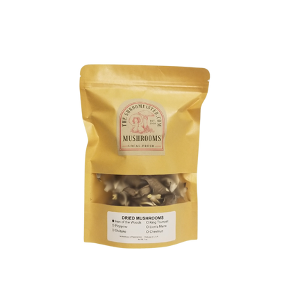 A package of dried Hen of The Woods mushrooms in a gold-colored resealable bag with a clear window showing the product inside.